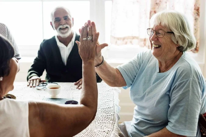 1_senior-women-giving-each-other-high-five-66148672